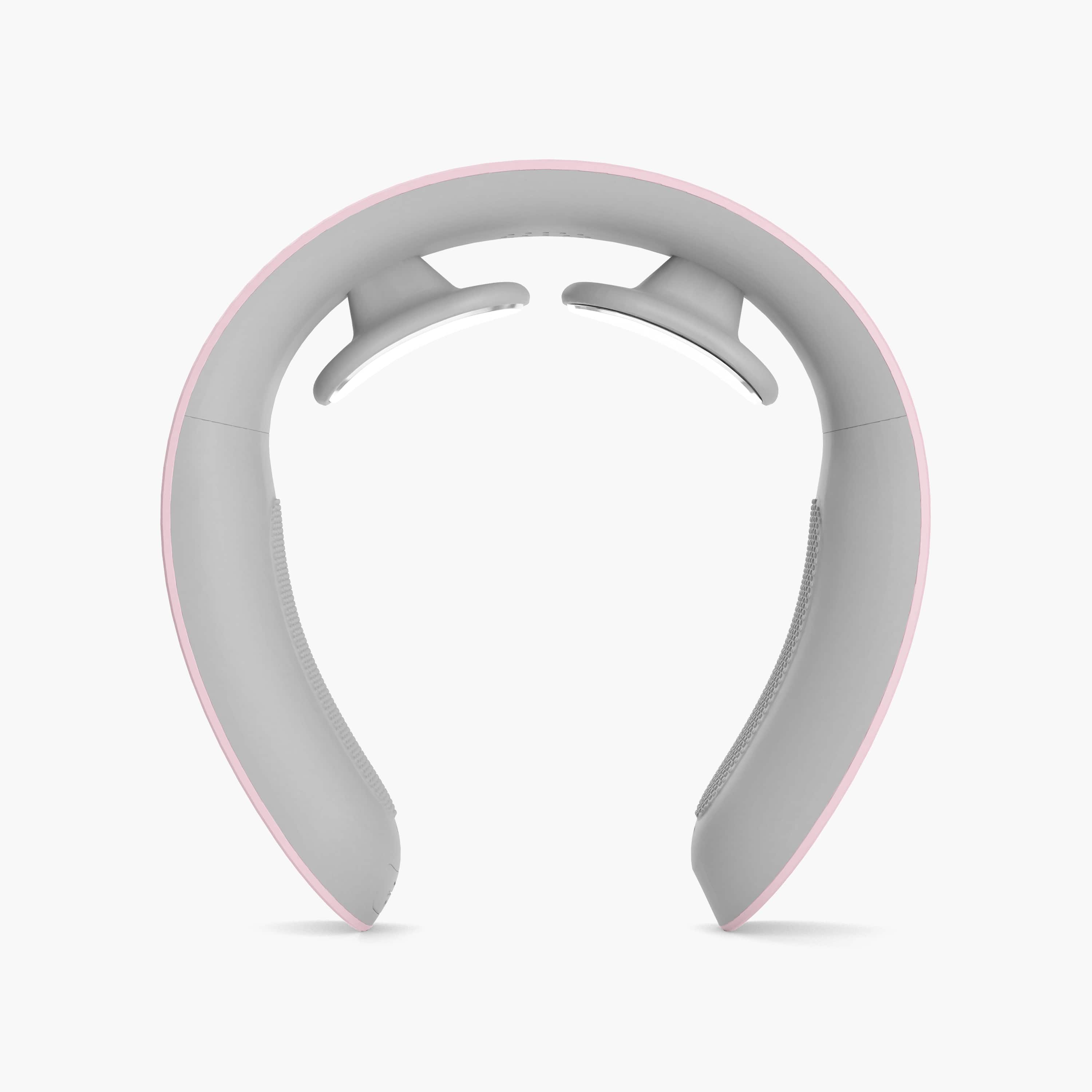 Luna by Nomisk. A pink neck massager that combines heat and pulse therapy to instantly relieve neck pain. Use her to relieve migraines, muscle tension and pain instantly. Shown from a bird's eye view.